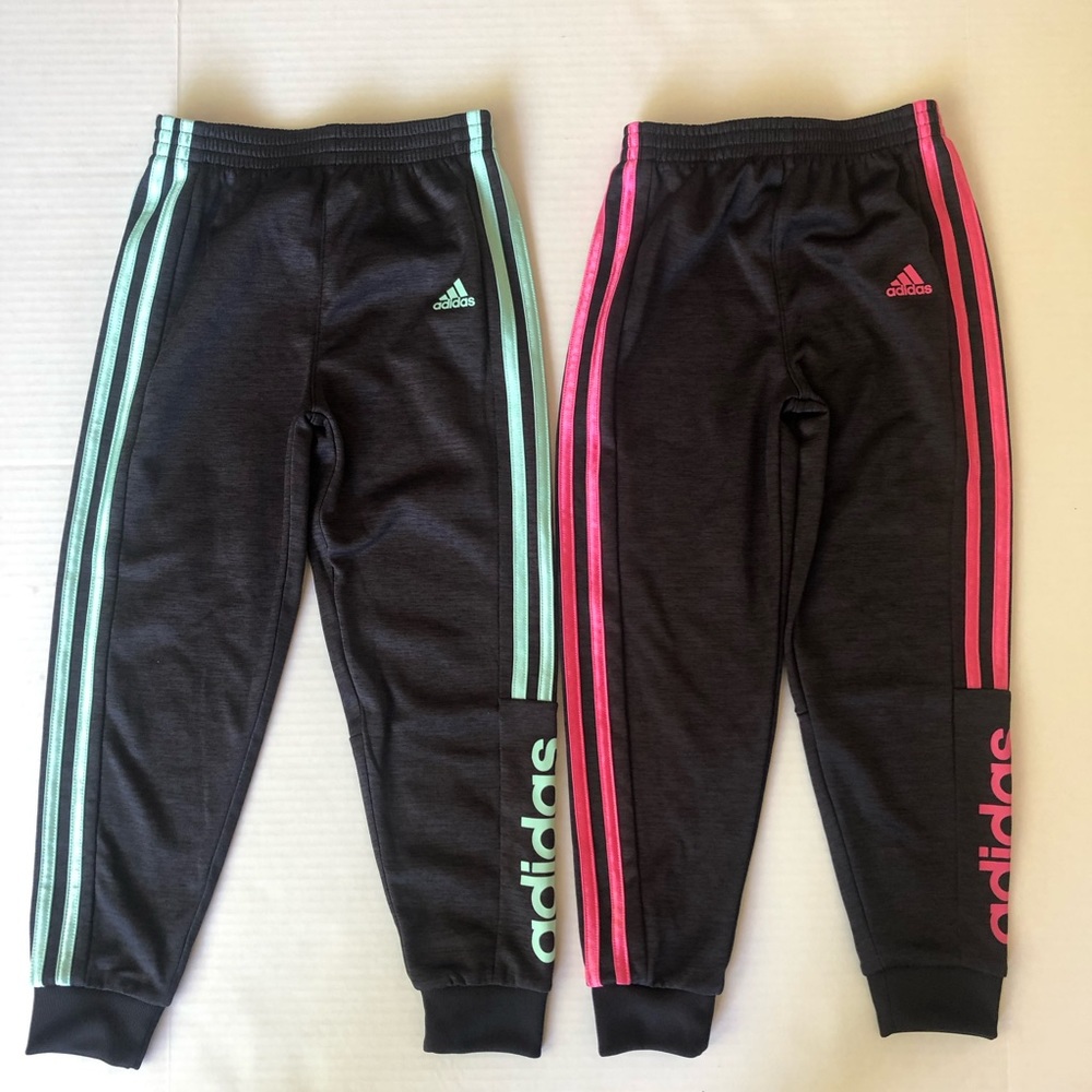 Like new adidas sweatpants size 6X color black, pink and light green.